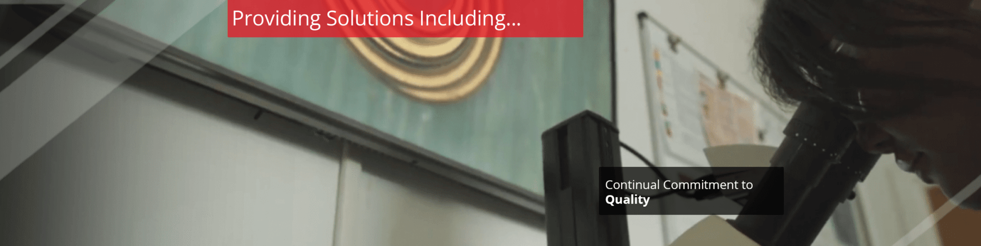 Low angle man looking into microscope